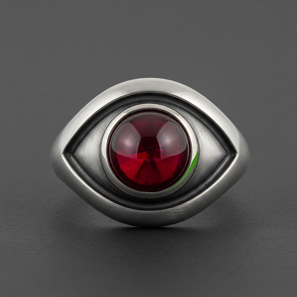 Eye-shaped ring with red cabochon Stone